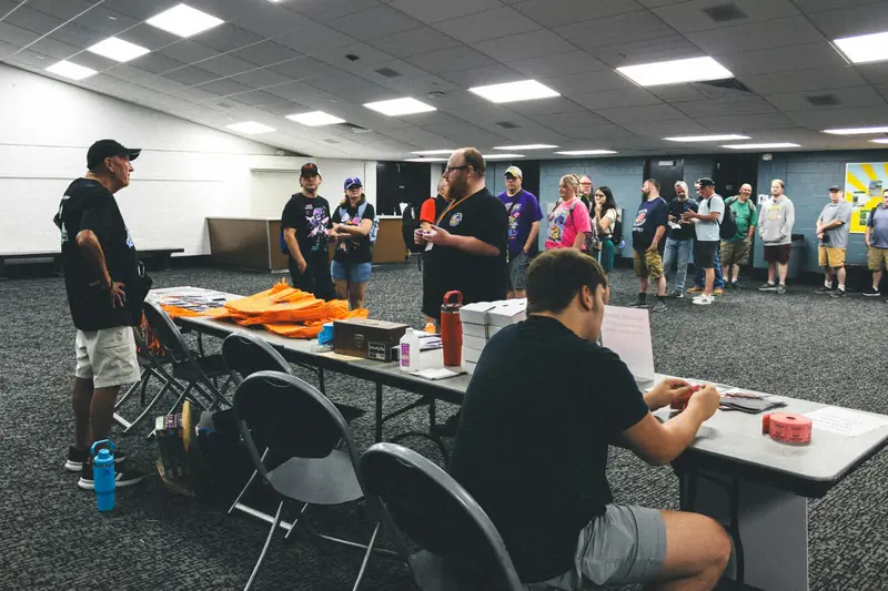 Audience seated at a tech event with speakers on stage